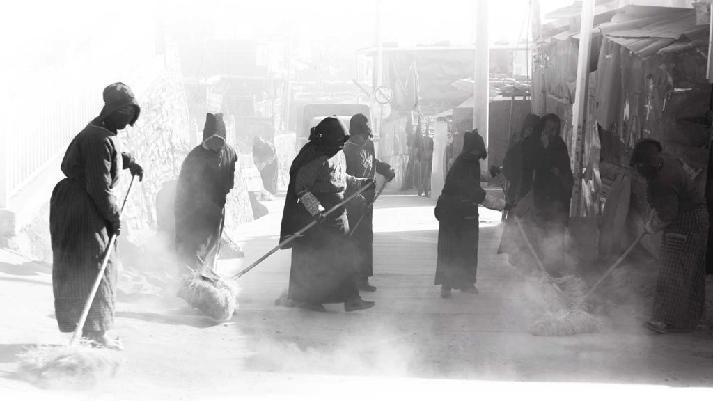 Tibetan cleaning floors